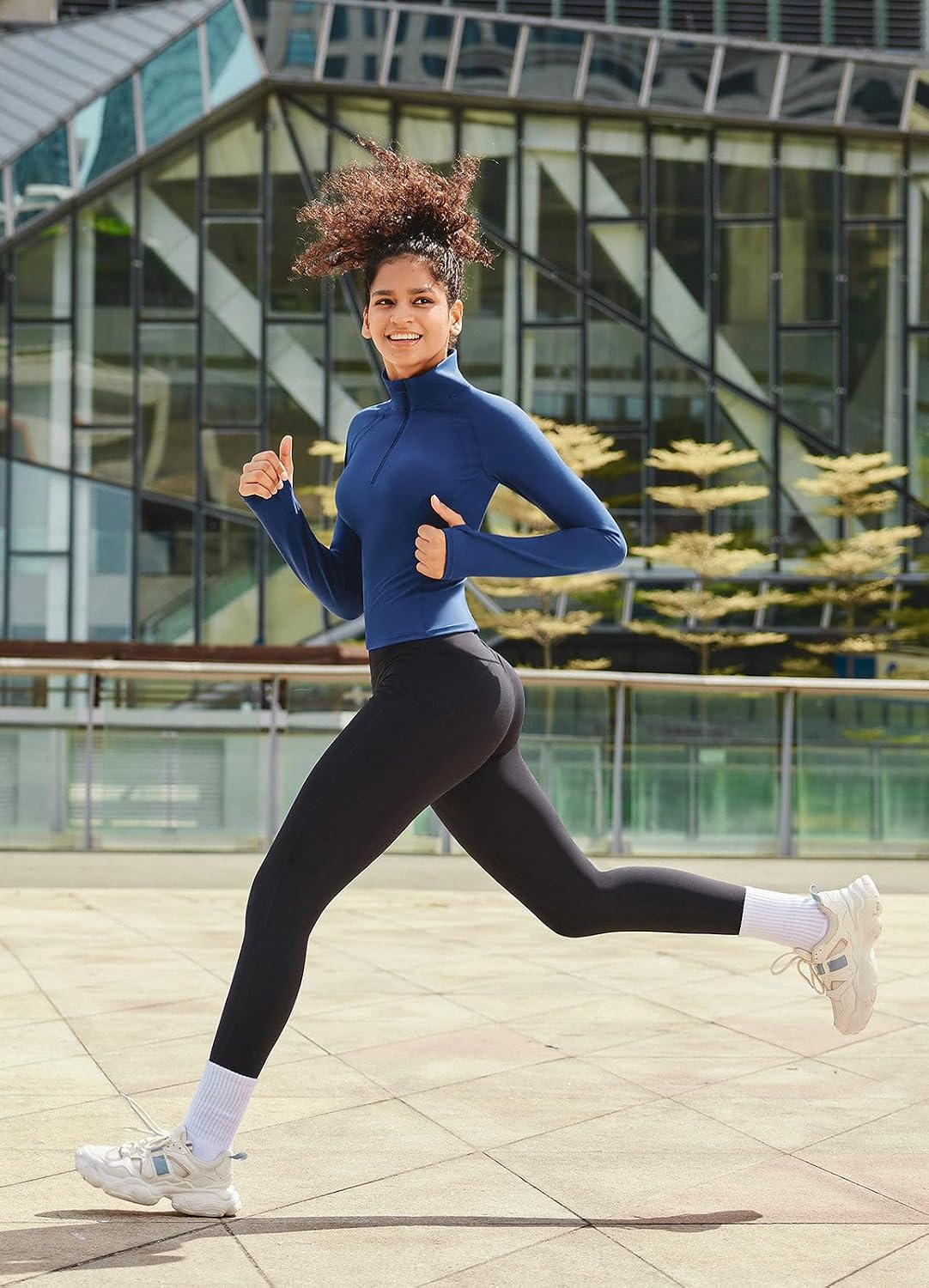 Woman running in baleaf fleece leggings