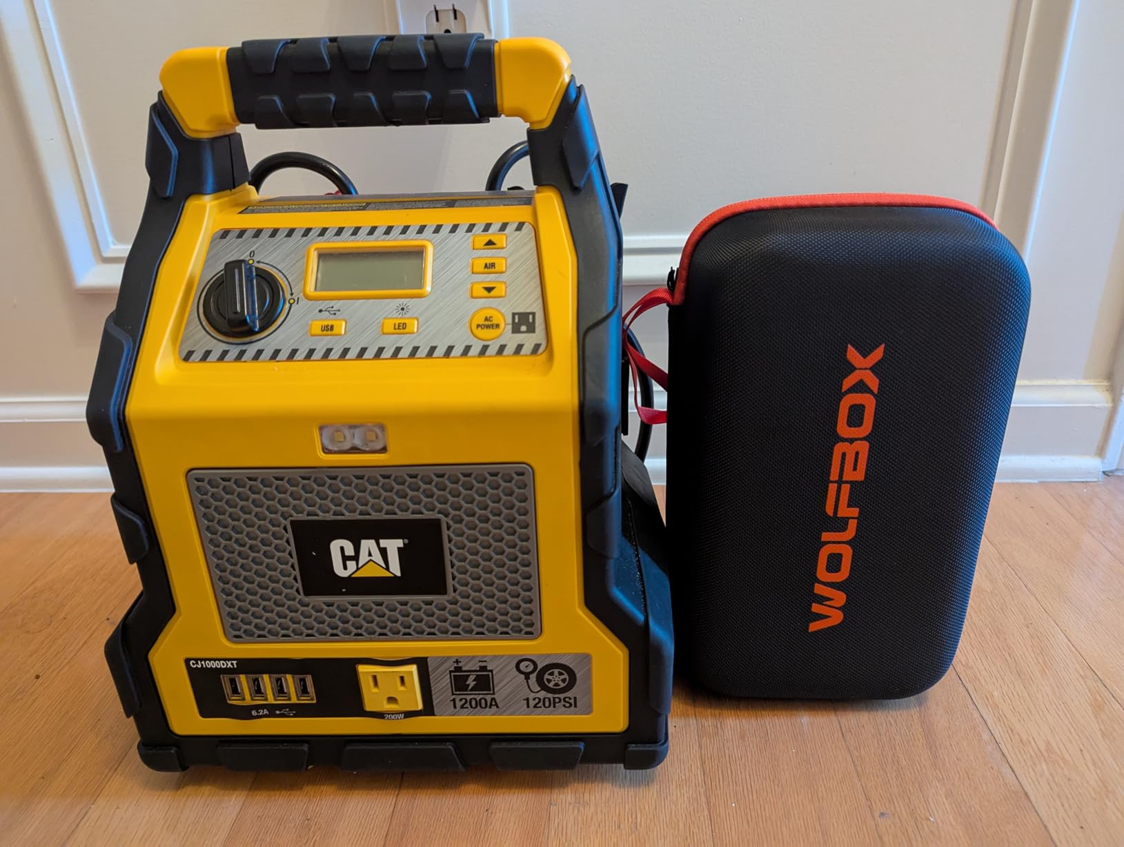 WOLFBOX MV16A air compressor inflating a tire