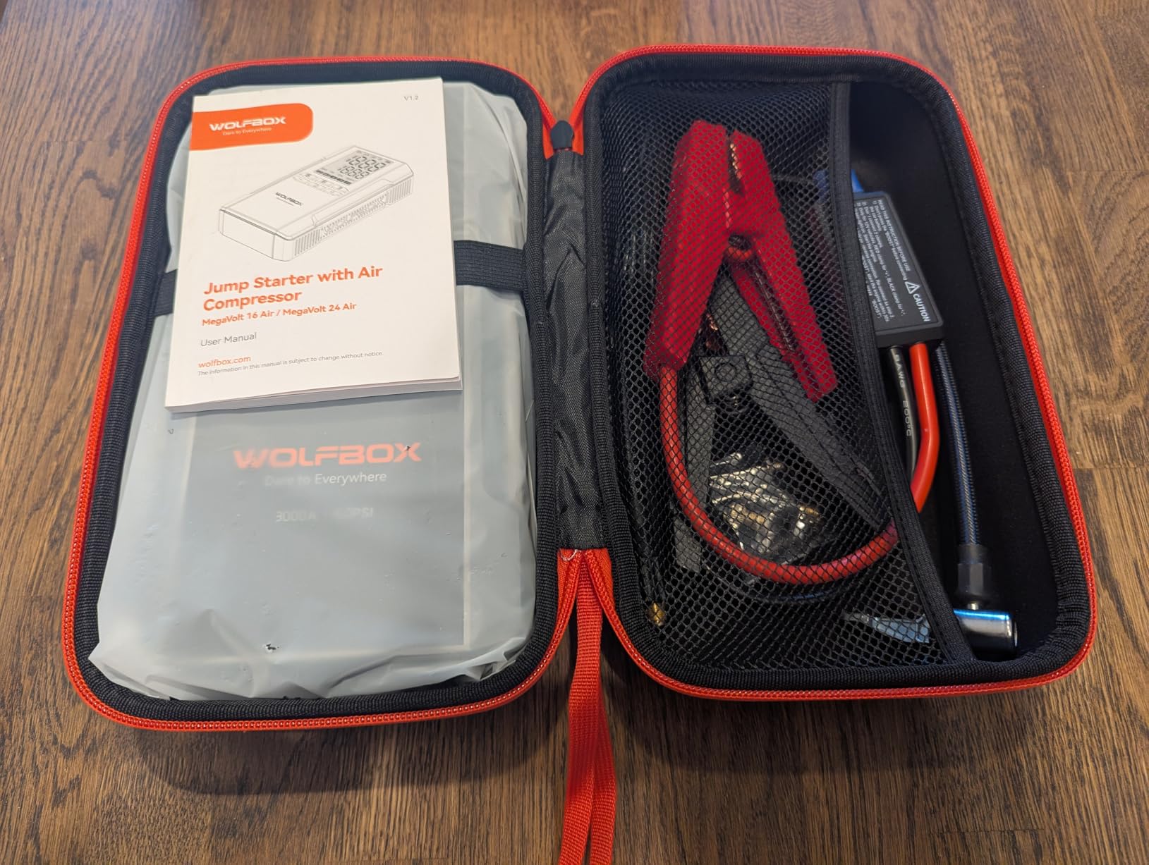 WOLFBOX MV16A stored in its carrying case in the trunk